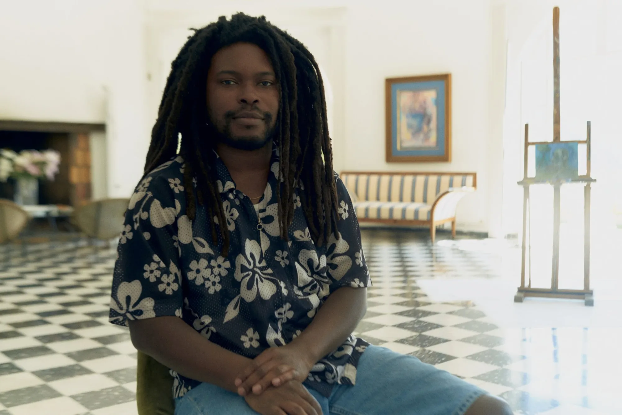 Sedrick Chisom seated in the salon at Castel Caramel